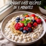 Creamy easy overnight oats recipes in mason jar topped with fresh strawberries, blueberries and granola