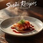 Finished homemade sushi recipes rolls sliced and arranged on platter with pickled ginger, wasabi and soy sauce