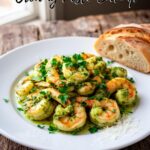 Shrimp, basil pesto, garlic, heavy cream and Parmesan cheese arranged for a fast and easy creamy pesto shrimp recipe